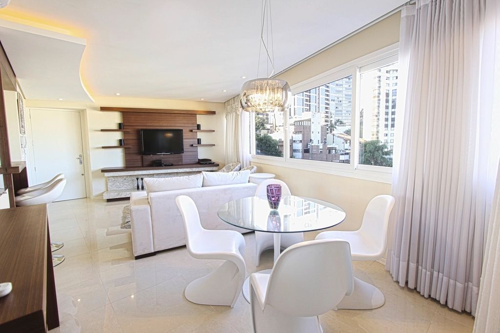 A suite sitting room with a sofa and armchairs
